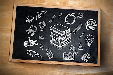 photo of desk with apple laptop - Composite image of education doodles against chalkboard Stock Photo - Budget Royalty-Free & Subscription, Code: 400-07683611