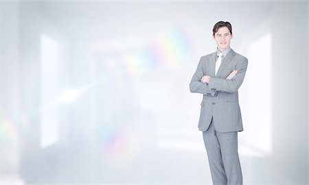 Assertive businessman standing  against digitally generated room Stock Photo - Budget Royalty-Free & Subscription, Code: 400-07683645