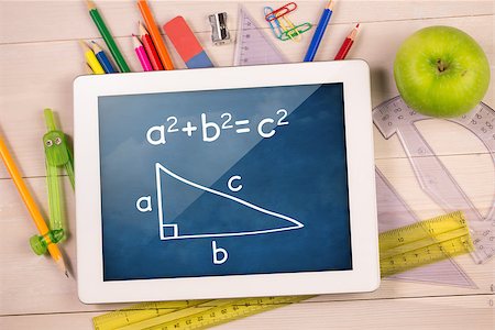 simsearch:400-07682840,k - Composite image of digital tablet on students desk showing math equations Fotografie stock - Microstock e Abbonamento, Codice: 400-07683777