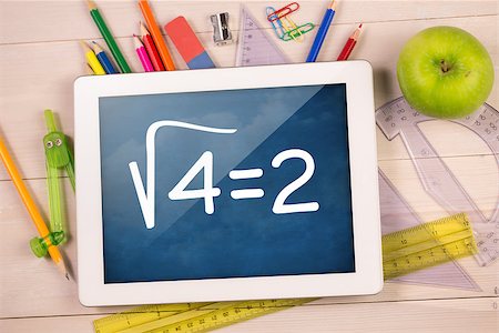 simsearch:400-07682840,k - Composite image of digital tablet on students desk showing math equations Fotografie stock - Microstock e Abbonamento, Codice: 400-07683789