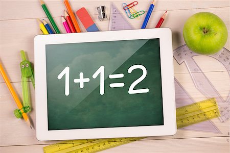 simsearch:400-07682840,k - Composite image of digital tablet on students desk showing math equations Fotografie stock - Microstock e Abbonamento, Codice: 400-07683790