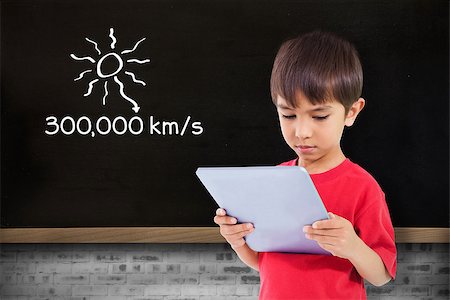 simsearch:400-07682840,k - Cute boy using tablet against blackboard on wall Fotografie stock - Microstock e Abbonamento, Codice: 400-07683810