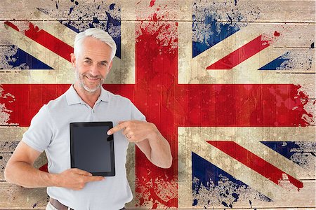 simsearch:400-07683875,k - Mature student showing tablet pc against union jack flag in grunge effect Foto de stock - Super Valor sin royalties y Suscripción, Código: 400-07683869