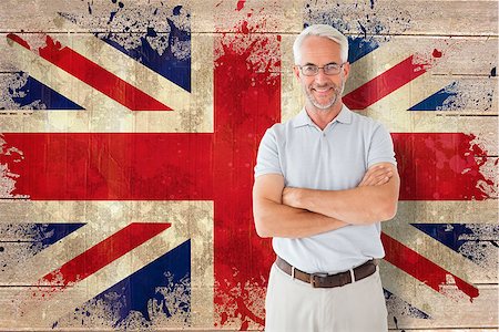 simsearch:400-07683875,k - Mature student smiling  against union jack flag in grunge effect Foto de stock - Super Valor sin royalties y Suscripción, Código: 400-07683873