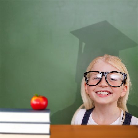 Composite image of cute pupil with graduate shadow in classroom Stock Photo - Budget Royalty-Free & Subscription, Code: 400-07683946