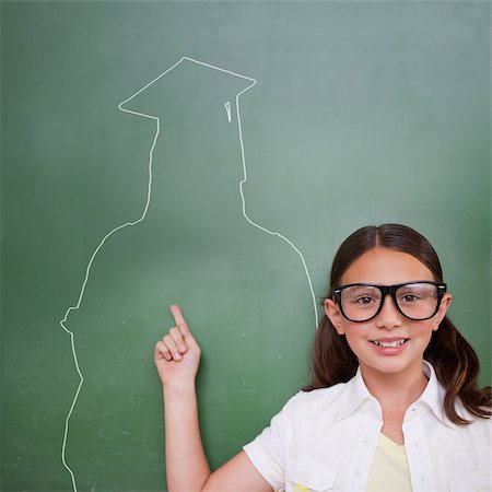 school kids graduate - Composite image of cute pupil with graduate outline in classroom Stock Photo - Budget Royalty-Free & Subscription, Code: 400-07683949