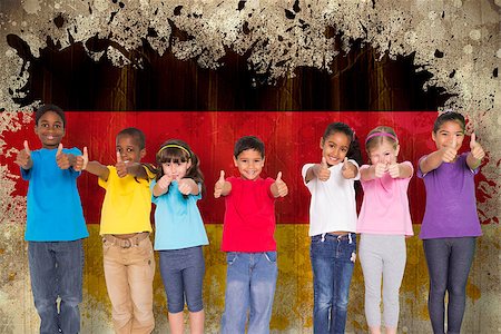 simsearch:400-06876753,k - Elementary pupils smiling showing thumbs up against germany flag in grunge effect Photographie de stock - Aubaine LD & Abonnement, Code: 400-07683978