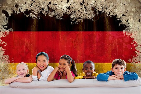 simsearch:400-06876753,k - Cute pupils smiling at camera against germany flag in grunge effect Photographie de stock - Aubaine LD & Abonnement, Code: 400-07683972