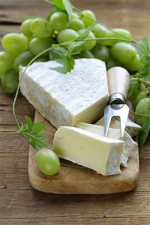 simsearch:400-05682309,k - Soft brie cheese with sweet grapes on a wooden board Stock Photo - Budget Royalty-Free & Subscription, Code: 400-07714065