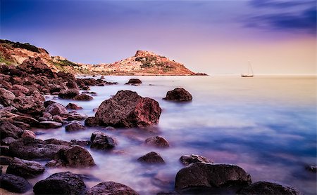 Ocean coastline with village in the background at sunrise, Castelsardo, Sardinia, Italy Stock Photo - Budget Royalty-Free & Subscription, Code: 400-07714155