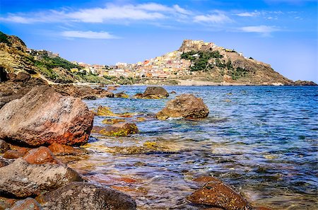 Rocky ocean coastline with colorful town Castelsardo, Sardinia, Italy Stock Photo - Budget Royalty-Free & Subscription, Code: 400-07714153