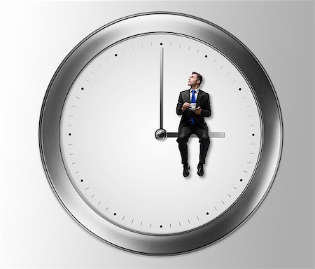 pointer stick - Businessman in suit with clock Stock Photo - Budget Royalty-Free & Subscription, Code: 400-07714339