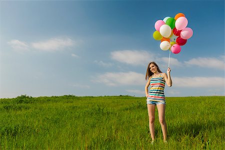 simsearch:400-08262183,k - Young beautiful woman with colorful balloons on a green meadow Stock Photo - Budget Royalty-Free & Subscription, Code: 400-07714420