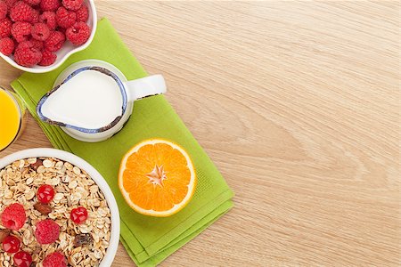 porridge and berries - Healty breakfast with muesli, berries and orange juice. View from above on wooden table with copy space Stock Photo - Budget Royalty-Free & Subscription, Code: 400-07714957