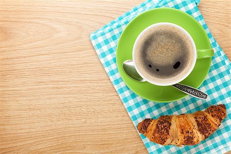 simsearch:400-06142439,k - Cup of coffee and fresh croissant on wooden table with copy space Stock Photo - Budget Royalty-Free & Subscription, Code: 400-07714951