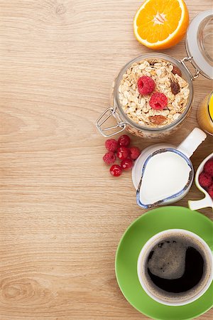 simsearch:400-08113690,k - Healty breakfast with muesli, berries, orange juice, coffee and croissant. View from above on wooden table with copy space Stock Photo - Budget Royalty-Free & Subscription, Code: 400-07714952