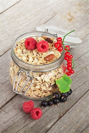 porridge and berries - Healty breakfast with muesli and berries. On wooden table Stock Photo - Budget Royalty-Free & Subscription, Code: 400-07714966