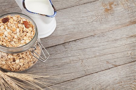 simsearch:400-08113690,k - Healty breakfast with muesli and milk. View from above on wooden table with copy space Stock Photo - Budget Royalty-Free & Subscription, Code: 400-07714974