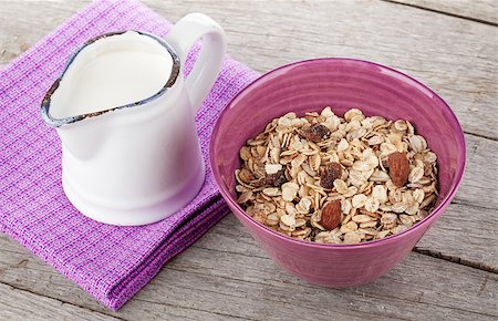 simsearch:400-08113690,k - Healty breakfast with muesli and milk. On wooden table Stock Photo - Budget Royalty-Free & Subscription, Code: 400-07714976