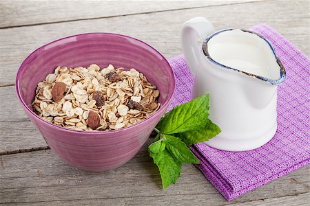 simsearch:400-08113690,k - Healty breakfast with muesli and milk. On wooden table Stock Photo - Budget Royalty-Free & Subscription, Code: 400-07714977