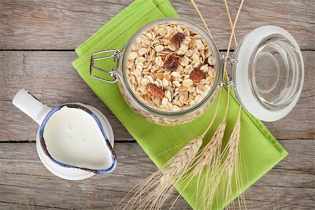 simsearch:400-04393799,k - Healty breakfast with muesli and milk. View from above on wooden table Stockbilder - Microstock & Abonnement, Bildnummer: 400-07715001