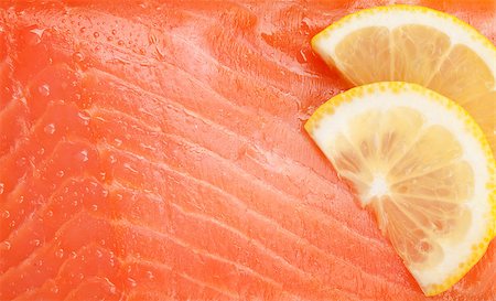 simsearch:400-08187570,k - Fresh salmon fish texture with lemon slices Stockbilder - Microstock & Abonnement, Bildnummer: 400-07715023