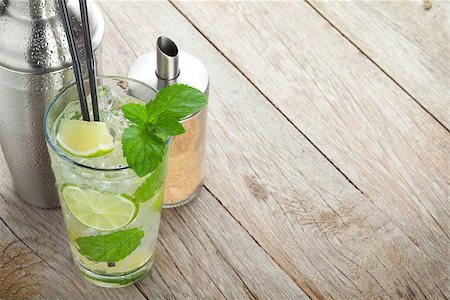 Fresh mojito cocktail and bar utensils. On wooden table with copy space Stock Photo - Budget Royalty-Free & Subscription, Code: 400-07715048