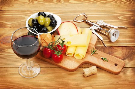 simsearch:400-07481818,k - Red wine with cheese, olives, bread, vegetables and spices on wooden table Foto de stock - Super Valor sin royalties y Suscripción, Código: 400-07715070