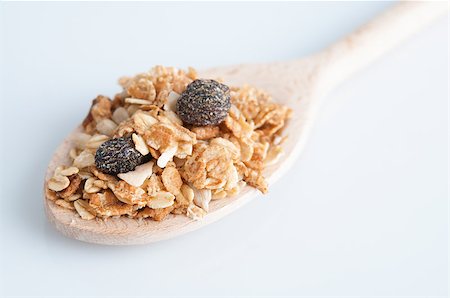 simsearch:400-04891088,k - Muesli morning breakfast on wooden spoon, plain background Stock Photo - Budget Royalty-Free & Subscription, Code: 400-07715199