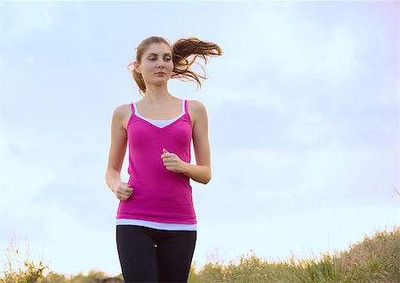 simsearch:6109-06004563,k - Young Beautiful Woman Running on the Mountain Trail in the Morning. Active Lifestyle Stockbilder - Microstock & Abonnement, Bildnummer: 400-07715439