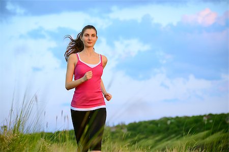 simsearch:6109-06004563,k - Young Beautiful Woman Running on the Mountain Trail in the Morning. Active Lifestyle Stockbilder - Microstock & Abonnement, Bildnummer: 400-07715445