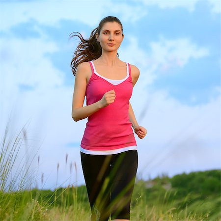 simsearch:6109-06004563,k - Young Beautiful Woman Running on the Mountain Trail in the Morning. Active Lifestyle Stockbilder - Microstock & Abonnement, Bildnummer: 400-07715446