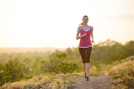 Young Beautiful Woman Running on the Mountain Trail in the Morning. Active Lifestyle Photographie de stock - Aubaine LD & Abonnement, Code: 400-07715441