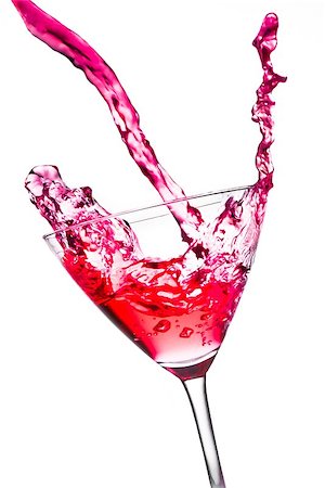 simsearch:400-08373093,k - red cocktail with splashing in the tilted glass on a white background Foto de stock - Royalty-Free Super Valor e Assinatura, Número: 400-07715601