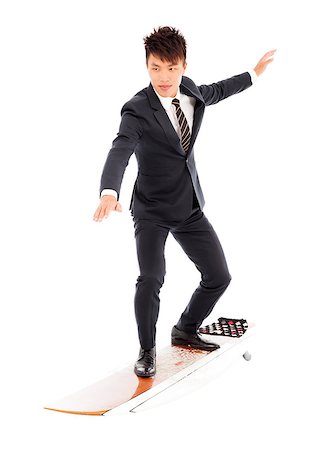 businessman practice surfing pose with suit Stock Photo - Budget Royalty-Free & Subscription, Code: 400-07715915