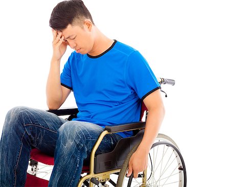 simsearch:400-07987656,k - upset handicapped man sitting on a wheelchair Stock Photo - Budget Royalty-Free & Subscription, Code: 400-07715984