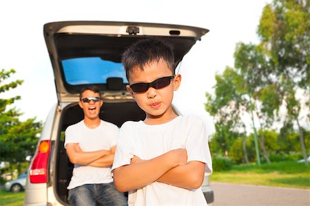 family suv - cool boy and father across arms with their car Stock Photo - Budget Royalty-Free & Subscription, Code: 400-07716030