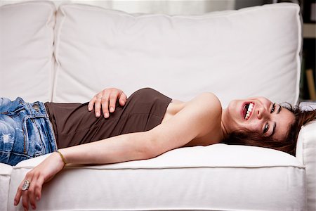 how much does this girl laugh ... a lot and with a toothy smile, because she's happy because everything is awesome in the world Stockbilder - Microstock & Abonnement, Bildnummer: 400-07716436