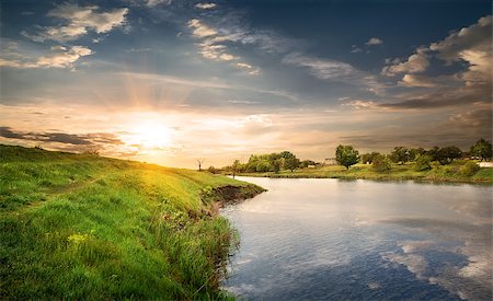 sun stream - Reflection in the calm river at sunset Stock Photo - Budget Royalty-Free & Subscription, Code: 400-07716466