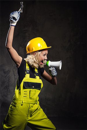 female workers in hard hats and tools - Attractive builder woman shouting through megaphone Stock Photo - Budget Royalty-Free & Subscription, Code: 400-07716868