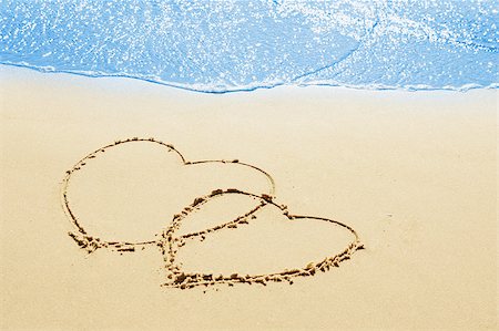 simsearch:400-08495448,k - hearts on the sand seashore - love and  romantic concept Stock Photo - Budget Royalty-Free & Subscription, Code: 400-07717287