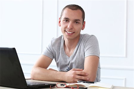 simsearch:400-07680948,k - Office, employee. Successful, young man at work Stock Photo - Budget Royalty-Free & Subscription, Code: 400-07717386