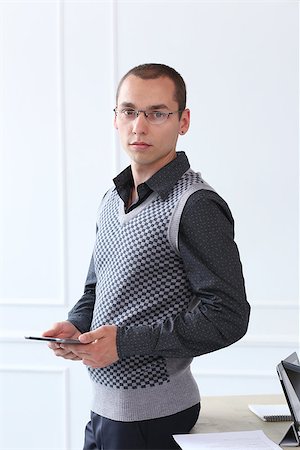 simsearch:400-07680948,k - Office, employee. Successful, young man at work Stock Photo - Budget Royalty-Free & Subscription, Code: 400-07717387