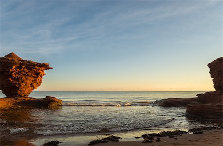 Red sandstone rocks at high tide (Green Gables Shore, Prince Edward Island , Canada) Stockbilder - Microstock & Abonnement, Bildnummer: 400-07717799