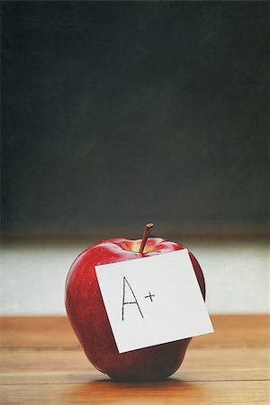 Red apple with note on desk with blackboard in background Stock Photo - Budget Royalty-Free & Subscription, Code: 400-07717888