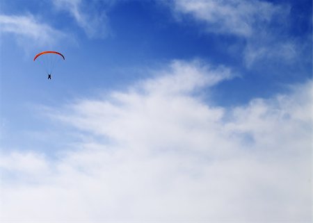 sky diver - Silhouette of skydiver at windy sky Foto de stock - Super Valor sin royalties y Suscripción, Código: 400-07718000