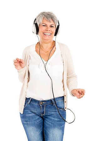 Elderly woman dancing while listen music with headphones, isolated over white background Stock Photo - Budget Royalty-Free & Subscription, Code: 400-07718354