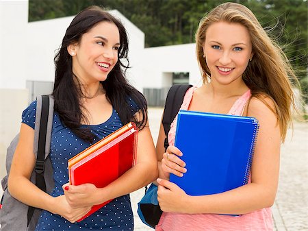 Two beautiful and happy teenage students smiling Stock Photo - Budget Royalty-Free & Subscription, Code: 400-07718377