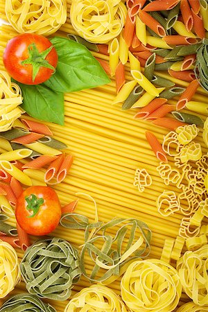simsearch:400-06796271,k - Various Italian pasta background with tomatoes and basil Stock Photo - Budget Royalty-Free & Subscription, Code: 400-07719027