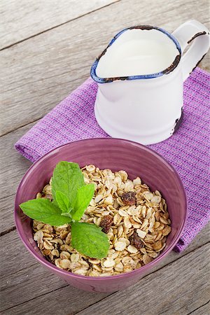 simsearch:400-08113690,k - Healthy breakfast with muesli and milk. On wooden table Stock Photo - Budget Royalty-Free & Subscription, Code: 400-07719058